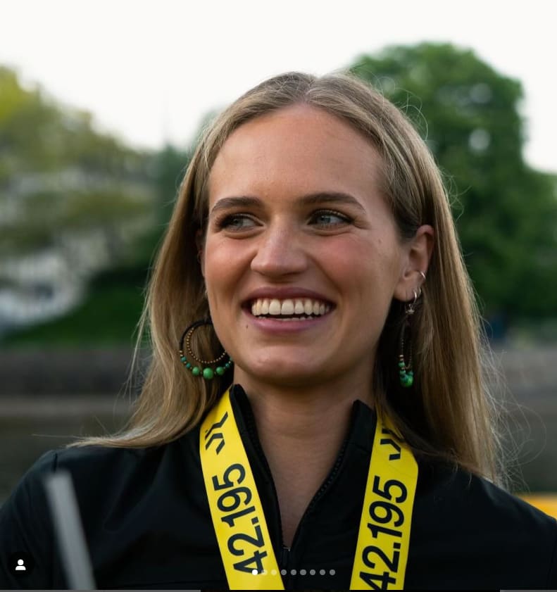 Photo shows 40tude runner Freya Sandberg wearing her Copenhagen Marathon  medal